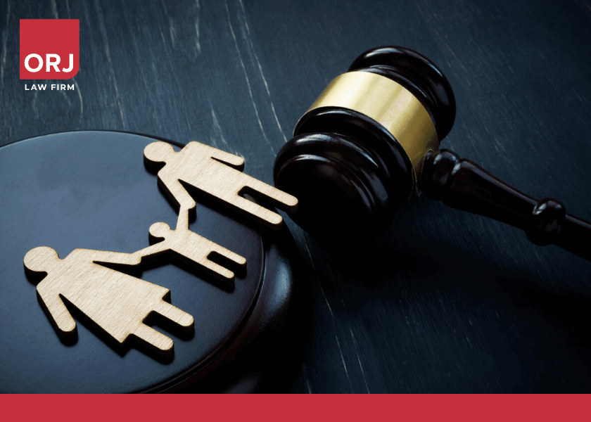 Wooden family figures and black gavel